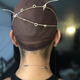 Crisscross: Face tape fastened in the back. Neck tape in place.